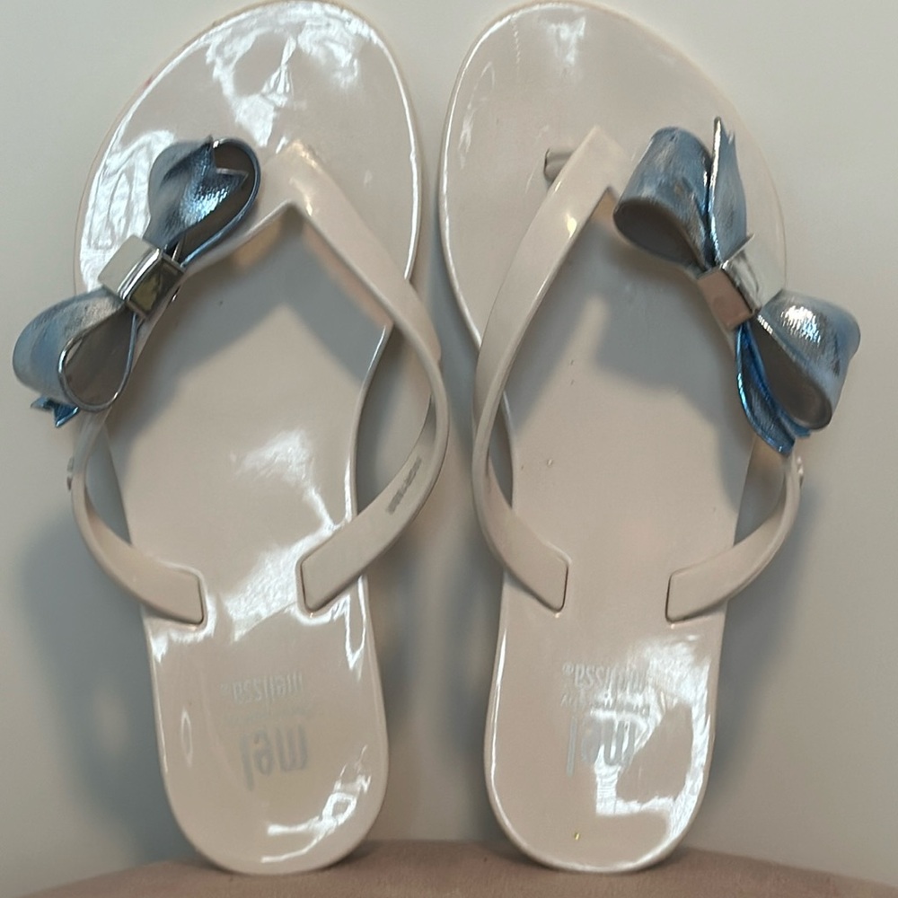 Gorgeous Mel by Melissa flip-flops! Size 12 in white and metallic blue.